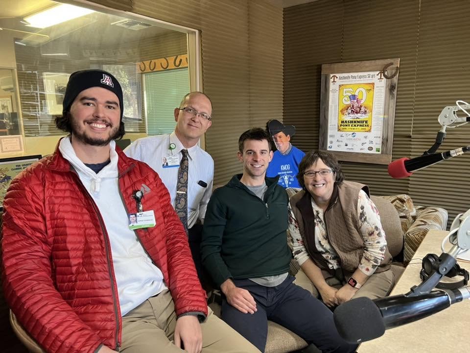 Medical trainees and community partners gathered at a local radio studio
